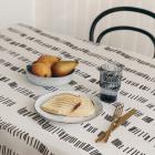                          White tablecloth in black piano keys
                         